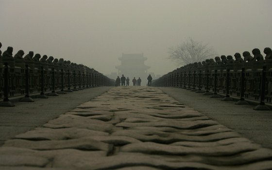 Hundreds of stone lions gaze at visitors on the Luguo Bridge.