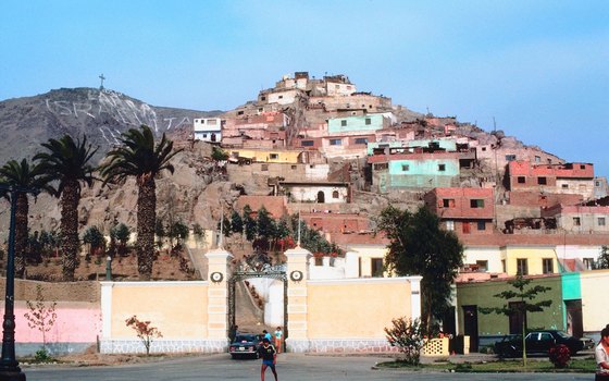 Don't miss a chance to photograph the real Peru, such as colorful houses on a Lima hillside.