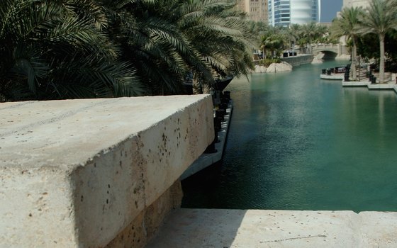 The Burj al Arab, visible from Dubai Creek, offers guests beach facilities.