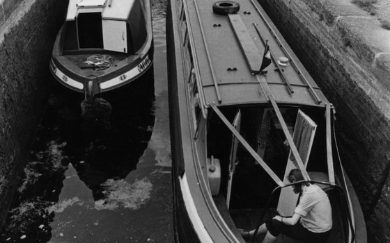 Two boats show off their narrowness.