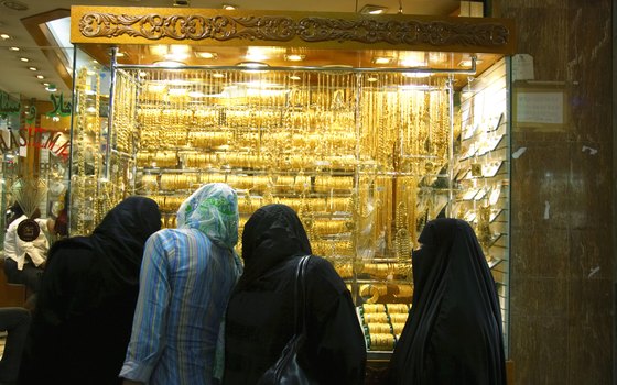 Visit a gold souk and experience the haggling over price.