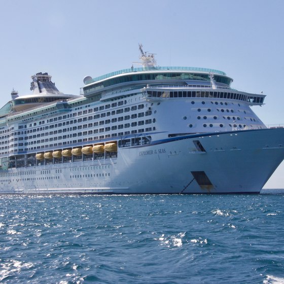A huge cruise ship sailing through the blue ocean.