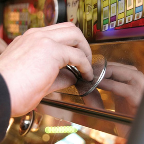 Slot machines charge a small amount for a slim chance of winning a large reward.