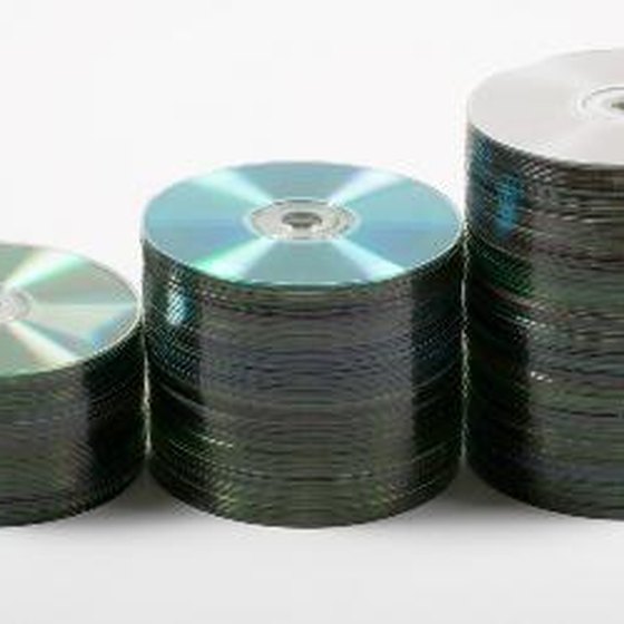 CDs and DVDs store data but require drives to read and write them.