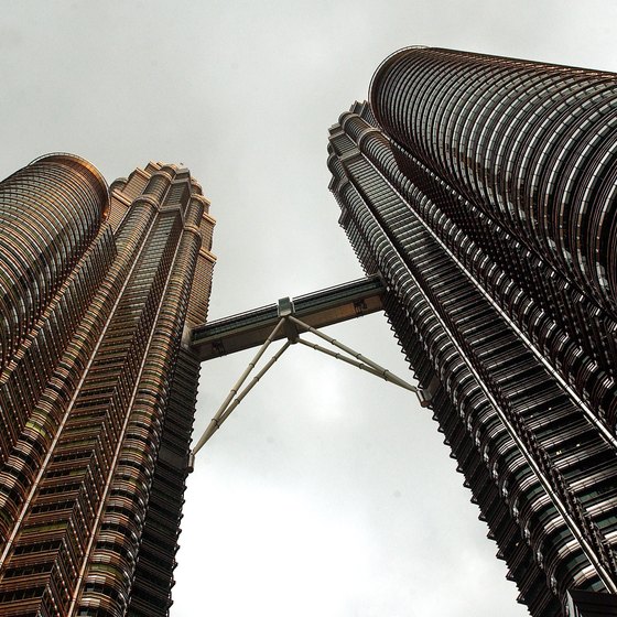 Stand beneath Kuala Lumpur's soaring Petronas Towers.