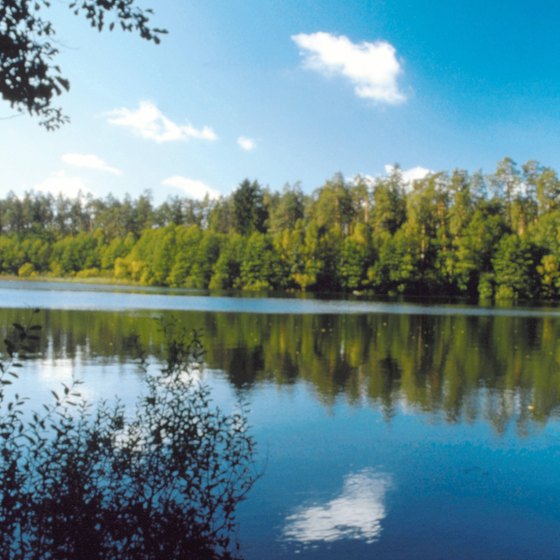 Garlands with candles are dropped into lakes and rivers at night.