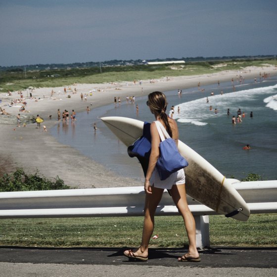 Surfers enjoy Rhode Island beaches.