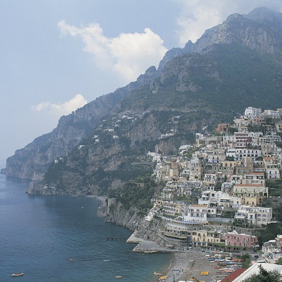 Positano can be reached by taxi or bus, but not by train.