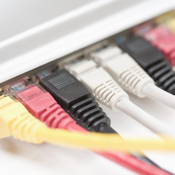 Multiple Ethernet patch cables connect to a workgroup switch.