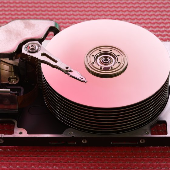Inside, a hard drive looks and works like an old-fashioned record player.