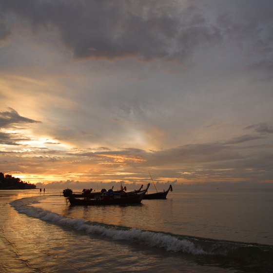 Long-tail boats are often necessary to reach the best snorkeling spots.