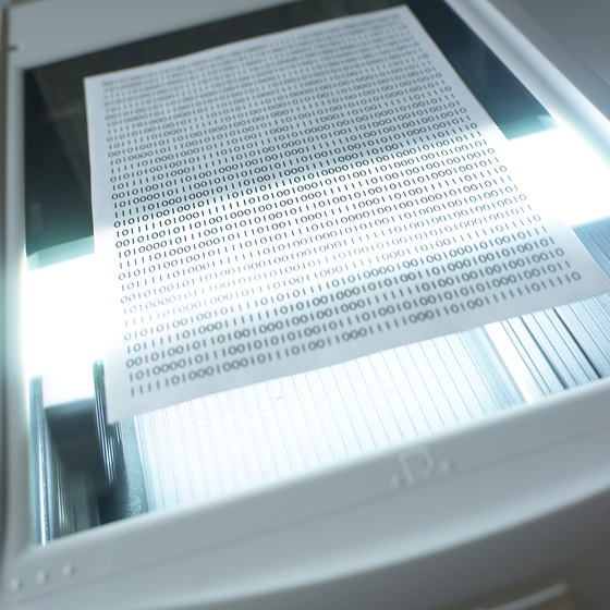 Dust on scanner glass causes streaks on scanned documents.