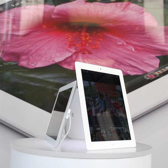 Salespeople use the iPad to help customers learn about and buy items.