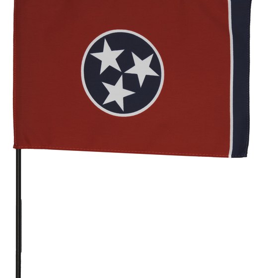 The three stars in the middle of the flag symbolize the three major geographic areas of Tennessee.