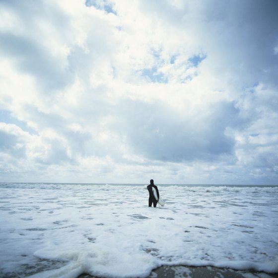 A lone surfer at Half Moon Bay, California.