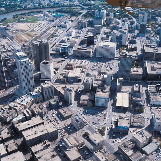 A view of downtown Winnipeg with the Red River winding through the background.