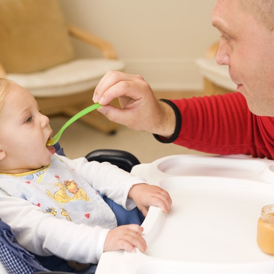 Other family members become part of baby's feeding routine at age 6 months.