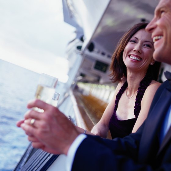 Enjoy champagne on the balcony of your suite as VIP cruise travelers.