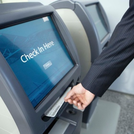 Book an electronic ticket and pick up your ticket at a kiosk in the airport.