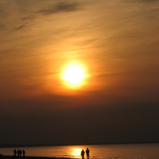 A sunset walk along the beach can be a great start to a romantic vacation.