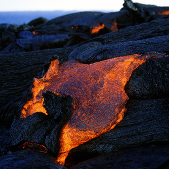 Kilauea volcano spills lava into the sea daily, creating more land for Hawaii.