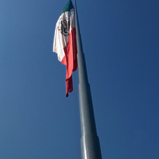 A Mexican flag flies over the border crossing outside of Tijuana.