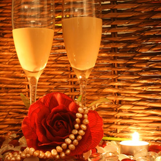Dinner and drinks by candlelight is one of many ways to make an evening romantic.