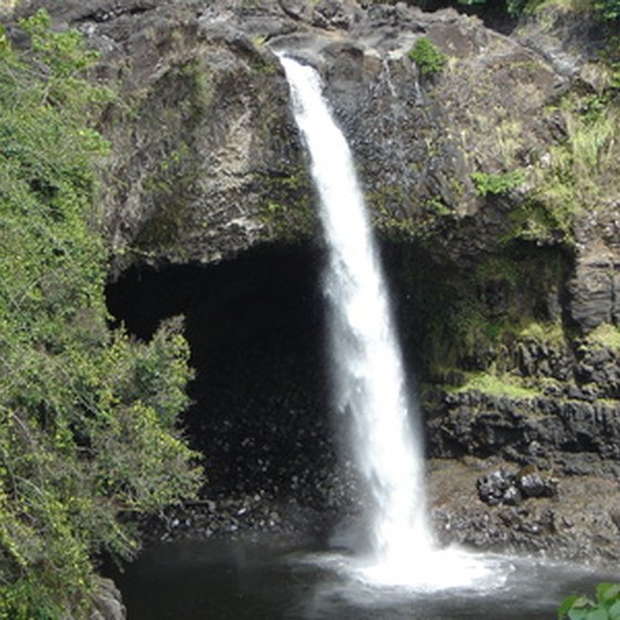 Swimming under a waterfall is just one of many unique experiences you can have on Oahu.