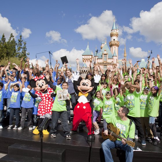 Visitors have fun with Mickey at Disneyland.