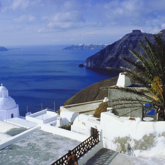 The bleached-white coastal villages of Santorini sharply contrast with the cobalt waters of the Aegean Sea.