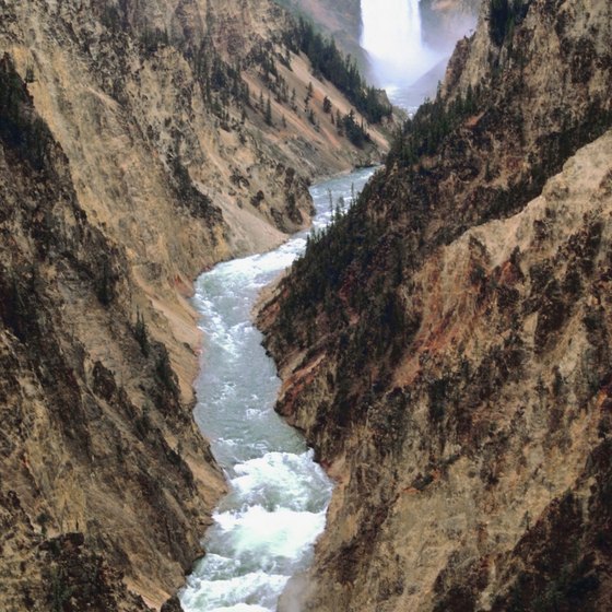 The Yellowstone River flows through Yellowstone Canyon, creating multiple waterfalls.