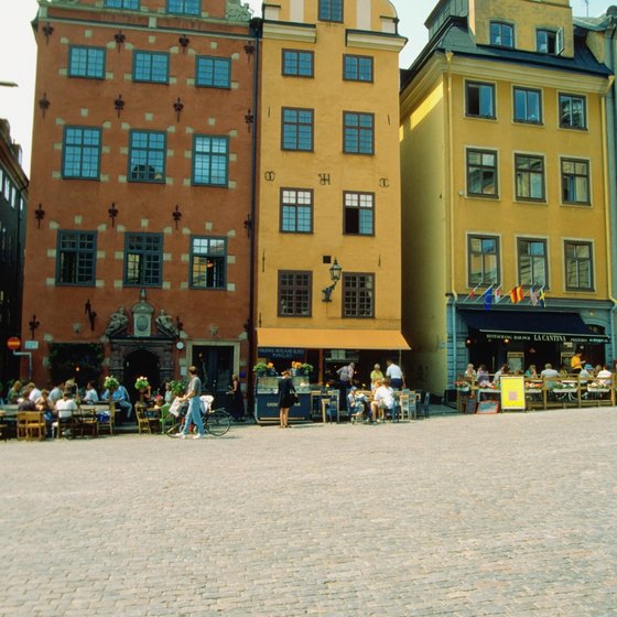 Visitors to Old Town Stockholm enjoy lunch in an open-air cafe.