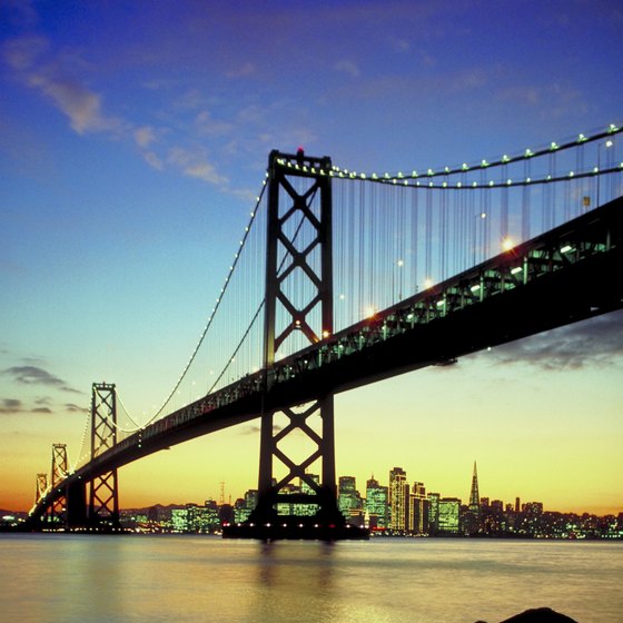 Bay waters and downtown buildings brighten under a vibrant San Francisco sunset.