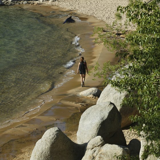 A hiker on the shore of Lake Tahoe