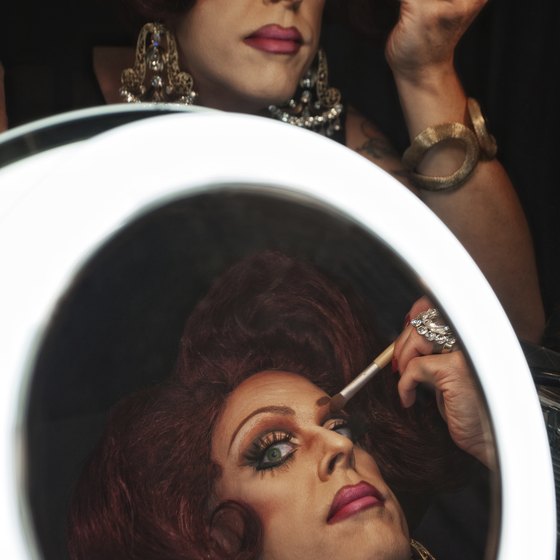 Performers spend hours turning masculine features into feminine ones.