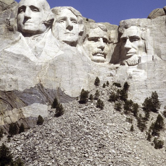 The sculptures on Mount Rushmore stand hundreds of feet high.
