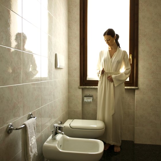 European-style bathrooms typically feature tile on both the floor and walls.