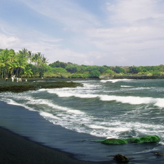Volcanic black sand is a striking difference between beaches in Hawaii and Miami.