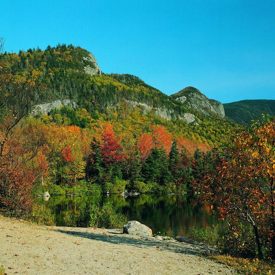 Changing fall leaves reflect on Echo Lake.