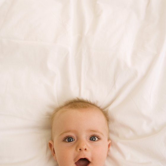 Your baby's head should be supported in his passport photo, so he can look right at the camera.