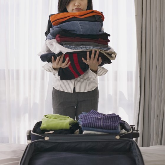 Rolling your clothes together instead of folding them one by one helps fit more in your carry on.