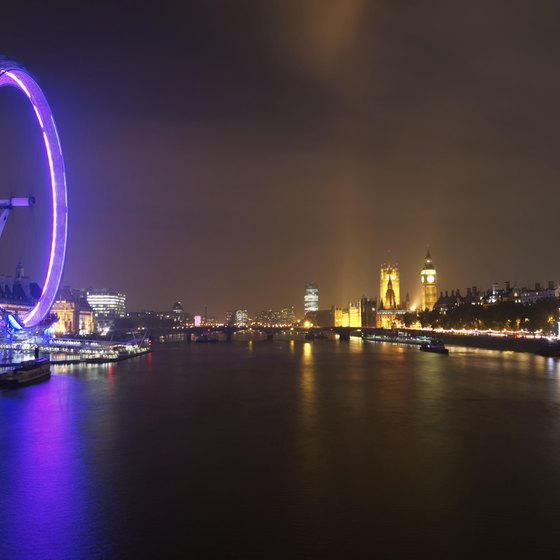At night the London Eye offers panoramic views of the illuminated city.