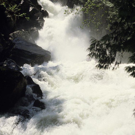 You can hike alongside one of the many waterfalls in Washington.