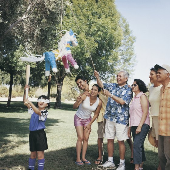 Mexican children often share pinatas full of candy at their parties.