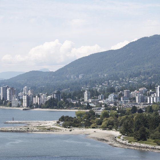 Vancouver, BC sits along the water and next to mountains.