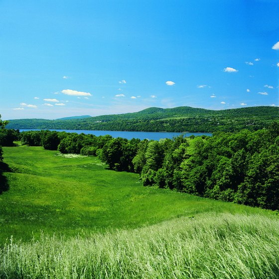 Green meadows stretch alongside the Hudson River Valley north of New York City.