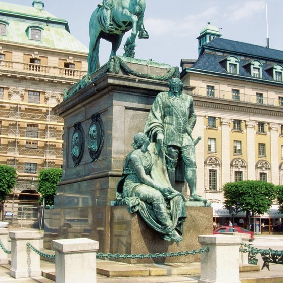 The statue of King Karl X Gustav of 17th century Sweden rises from the fountain at Stortoget Square in the center of Malmo.