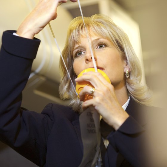 Pay attention to the flight attendant as she presents the safety briefing.