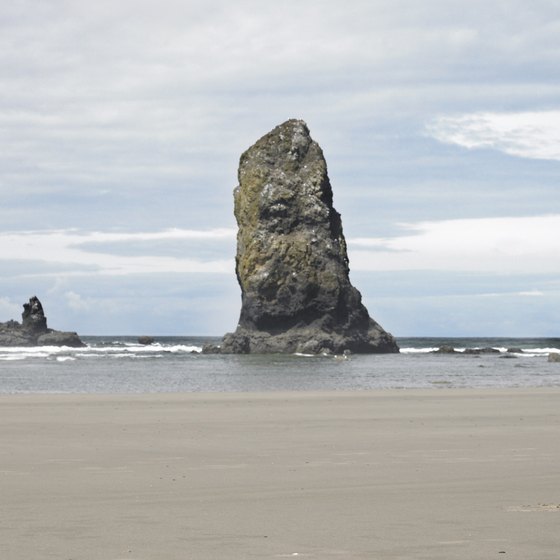 Vacationers enjoy walking on the sandy beaches of the Oregon coast.