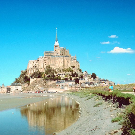 Mont Saint-Michel, a Medieval abbey, seems to rise from the sea off France's Normandy shore.